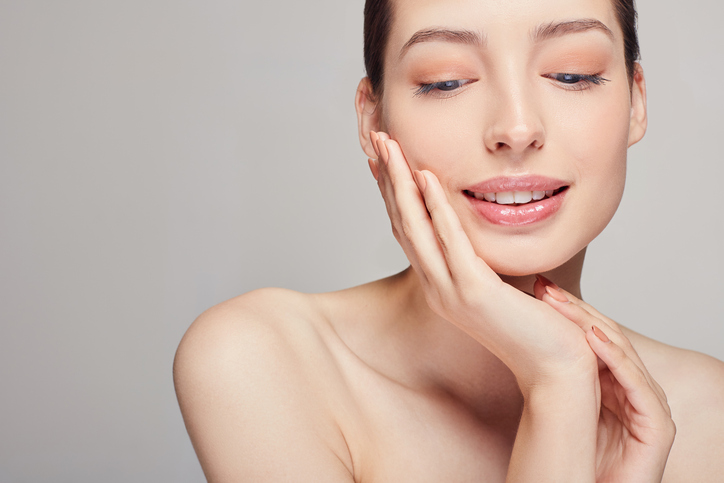 Woman touching her face